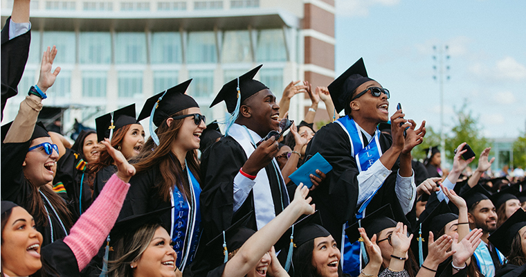 Student graduates in the commencement crowd