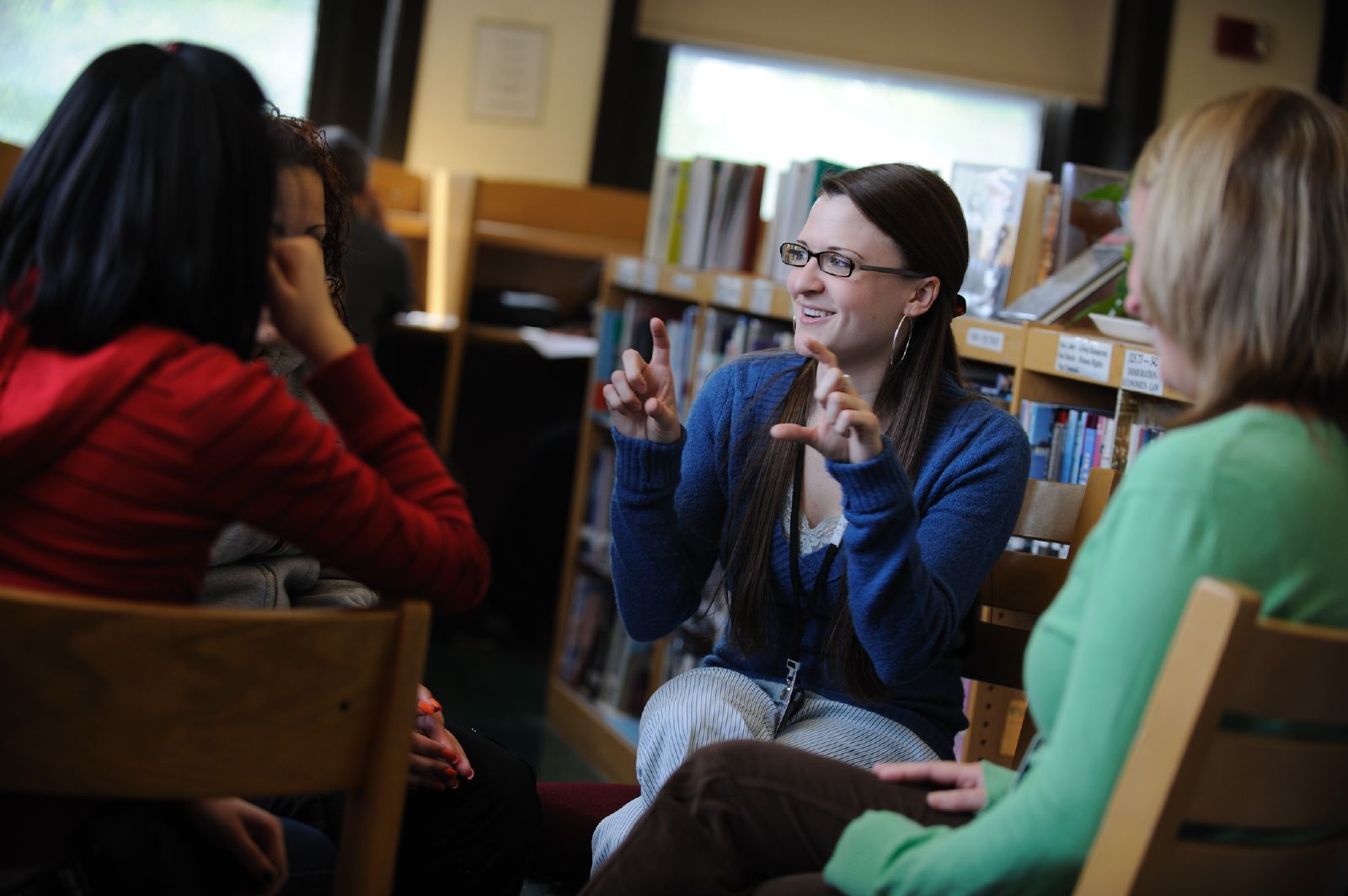 Psychology professor gestures to students