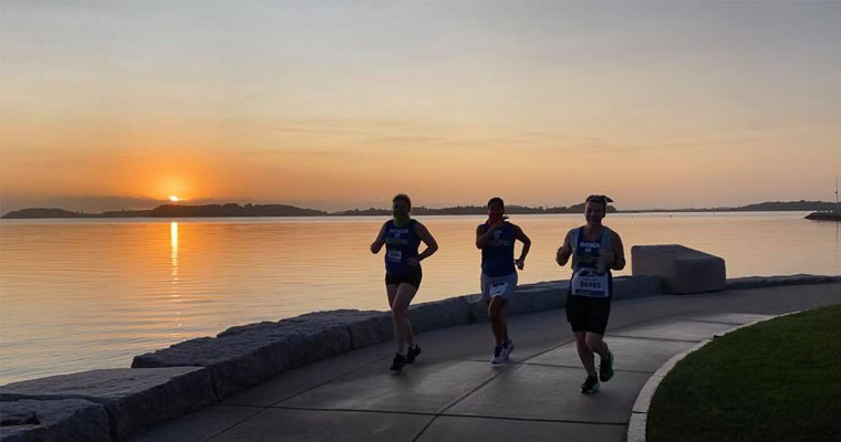 Kathleen Kirleis, Dina Scarpelli, and Rhonda Hodge ran a virtual Boston Marathonon the HarborWalk. 