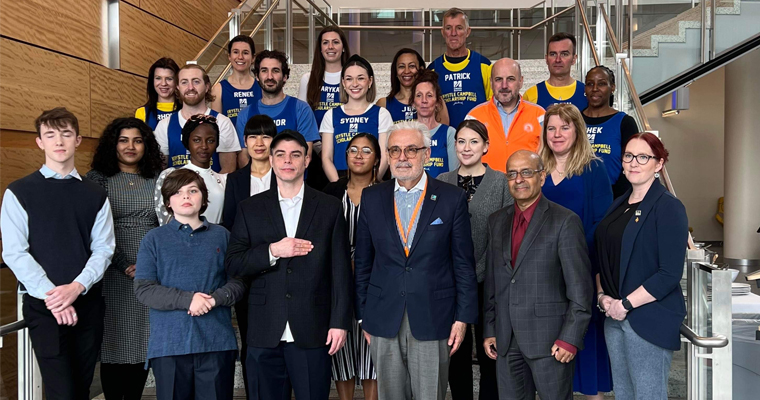 Krystle Campbell Marathon team and Chancellor Marcelo Suárez-Orozco in University Hall 