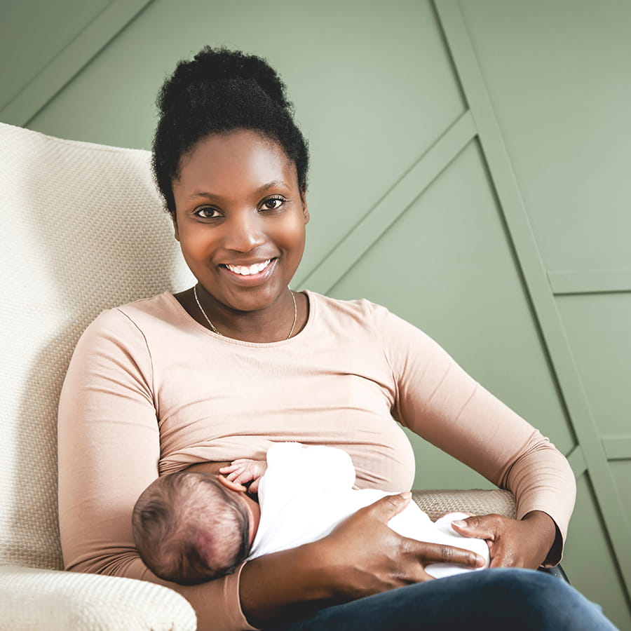 Mother holding and breastfeeding her baby.