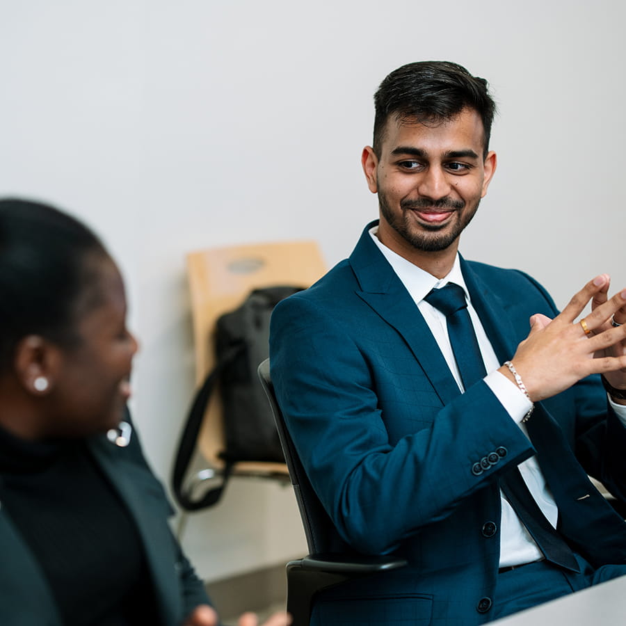 business students sitting at conference table
