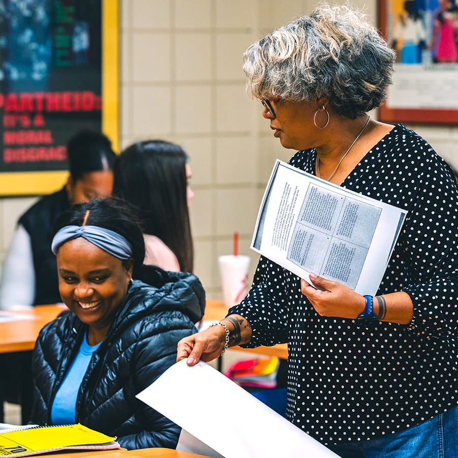Early Education Graduate Class in session - teacher with students