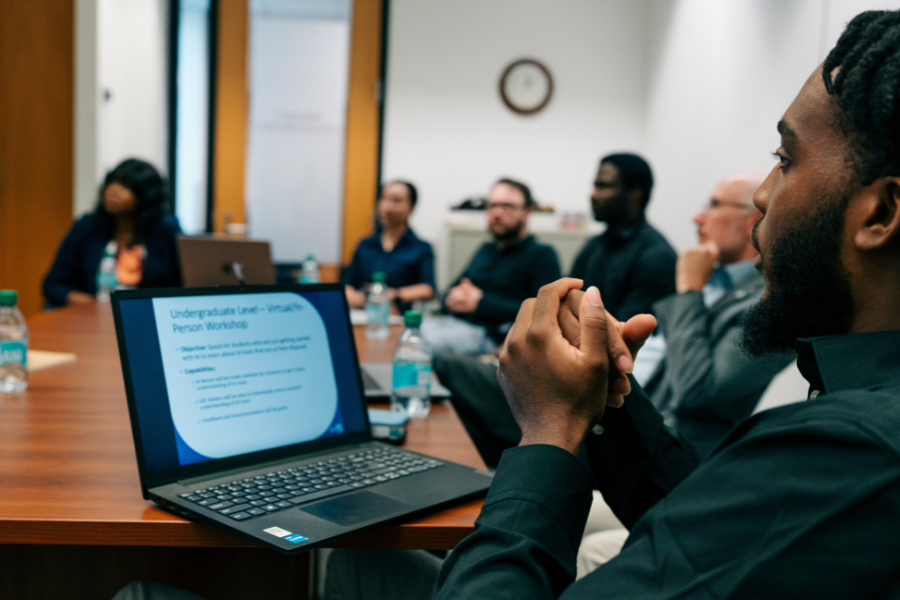 Students sitting around a conference table