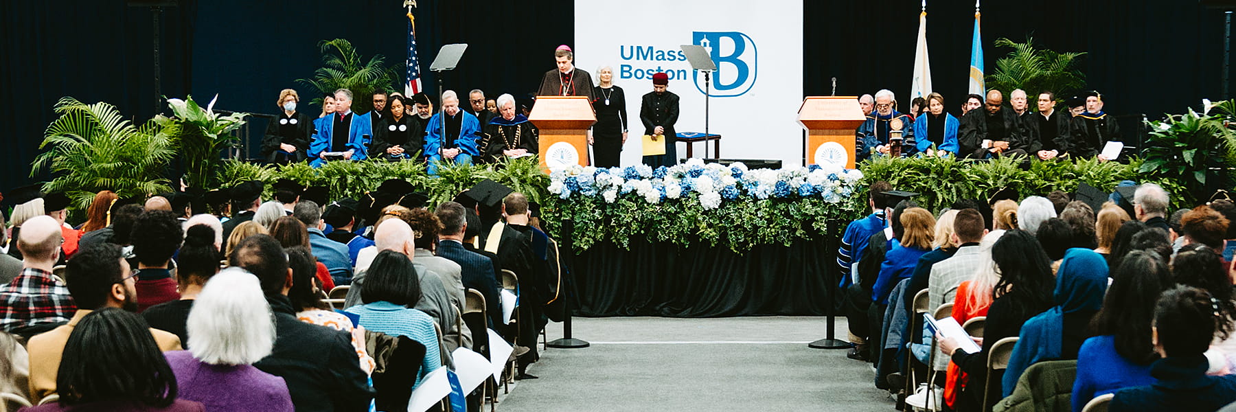 speakers at podium Chancellor, Marcelo Suárez-Orozco inauguration.