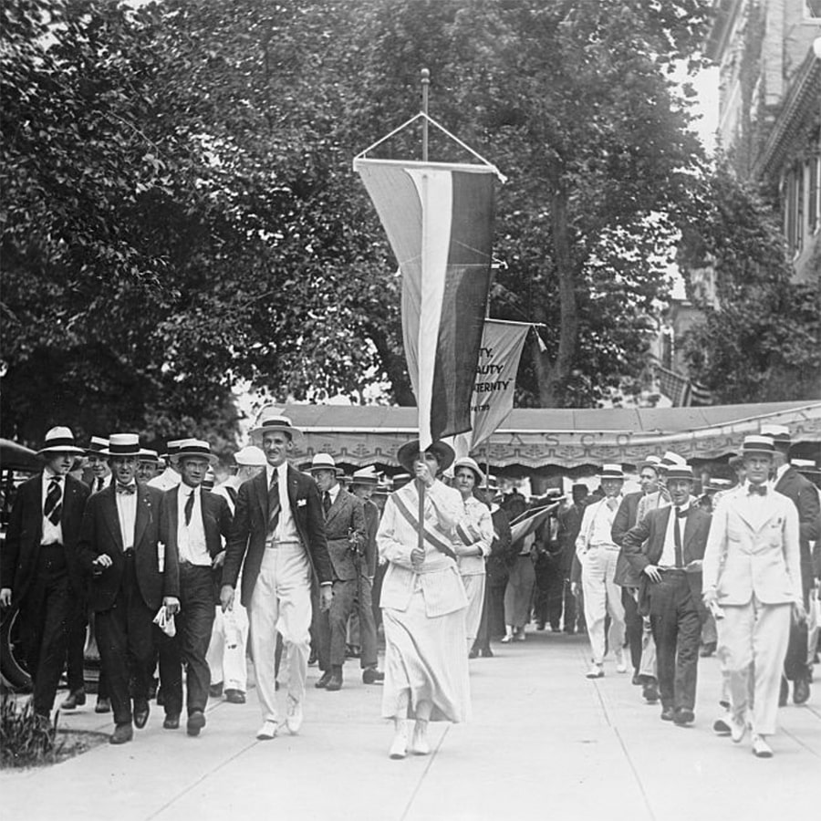 suffragette marching with banner - Harris & Ewing Photographs Collection - Library of Congress