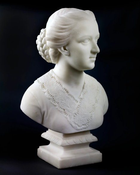 A white marble bust of a woman